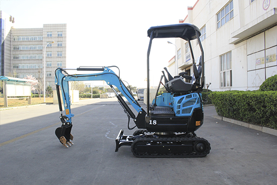Simple operations being carried out on a small excavator during spring startup test run to check hydraulic system