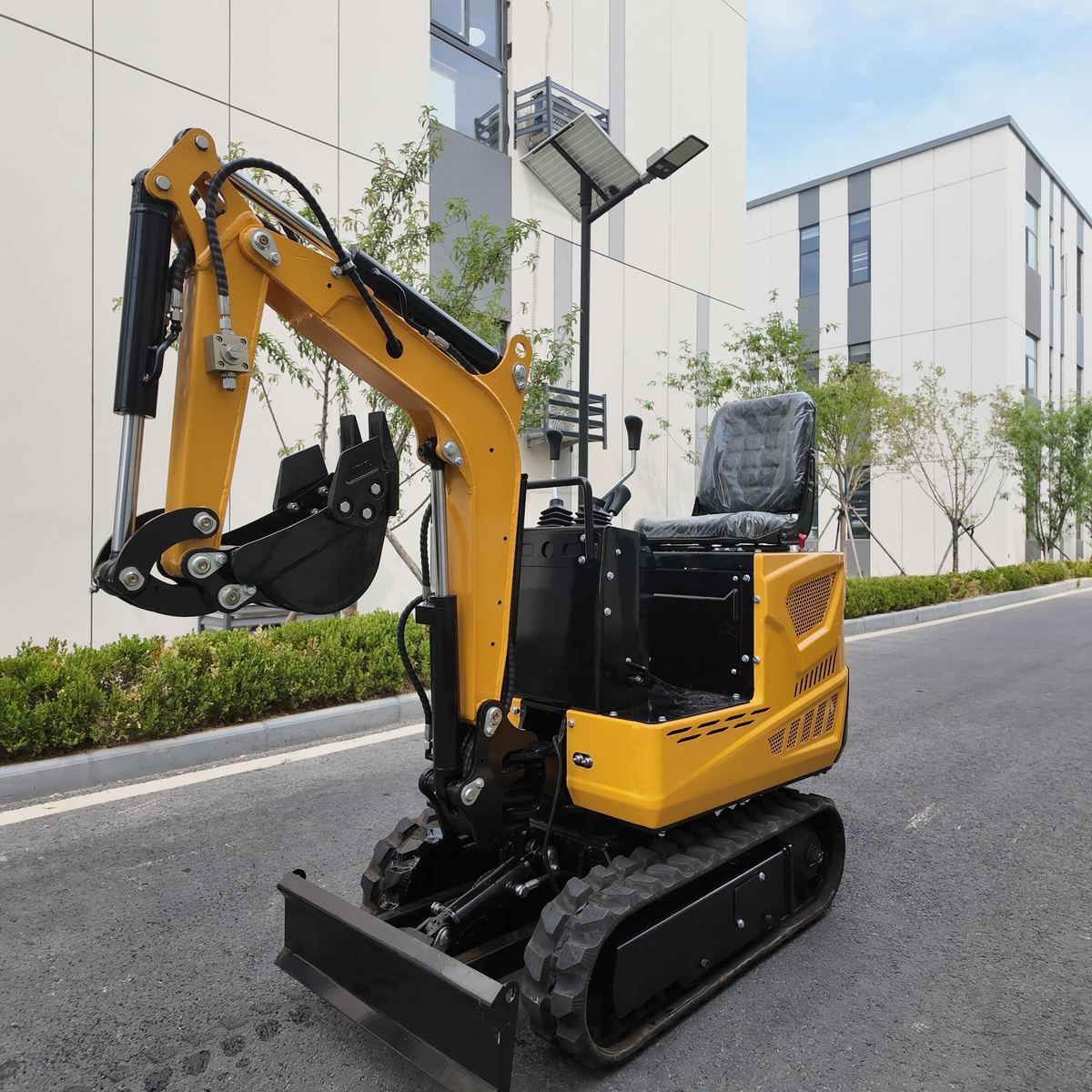TOVISEN 06-class mini excavator in side profile with bucket raised, product display