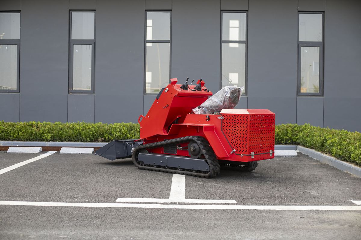 TOVISEN T490 seated track skid steer regrading a gravel driveway with bucket TOVISEN T490 seated track skid steer regrading a gravel driveway with bucket